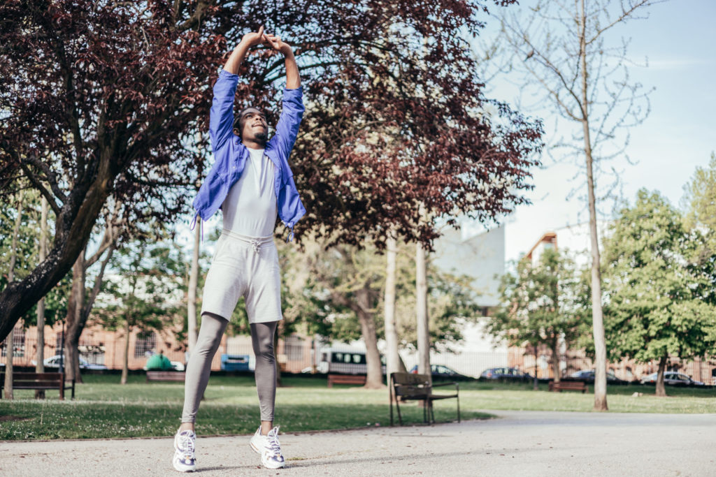 african american man warming up in order to prevent injuries in his workout