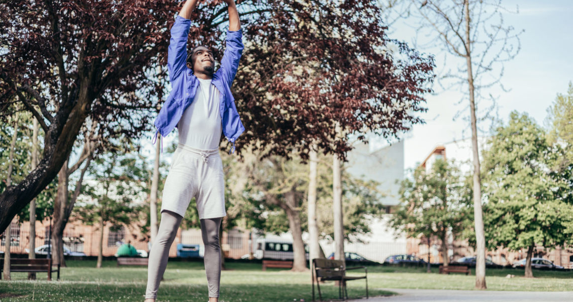 african american man warming up in order to prevent injuries in his workout